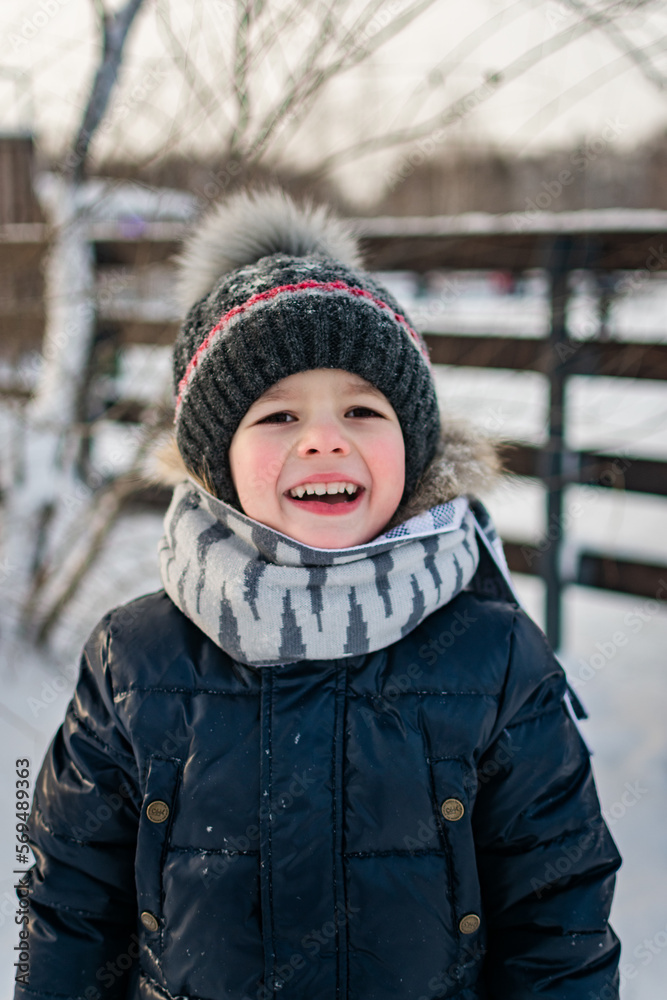 portrait of a happy child in a winter park