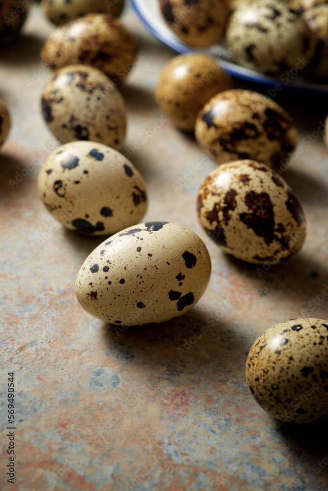 Quail eggs on a stone table.