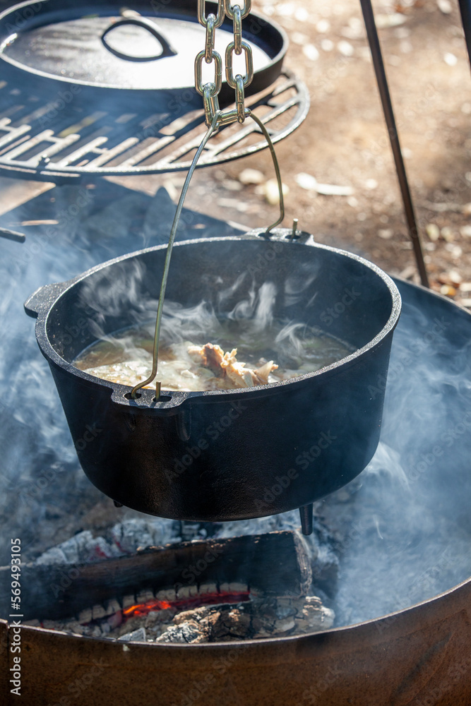 Smoking chicken stock cooked over open wood fire Smoking chicken stock cooked over open wood fire
