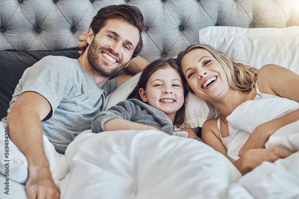 Love, family and portrait in home bedroom, laughing at funny joke and bonding together. Care, comic and happy man, woman and girl, child or kid in bed, having fun and enjoying quality time in house. Love, family and portrait in home bedroom, laughing at funny joke and bonding together. Care, comic and happy man, woman and girl, child or kid in bed, having fun and enjoying quality time in house.