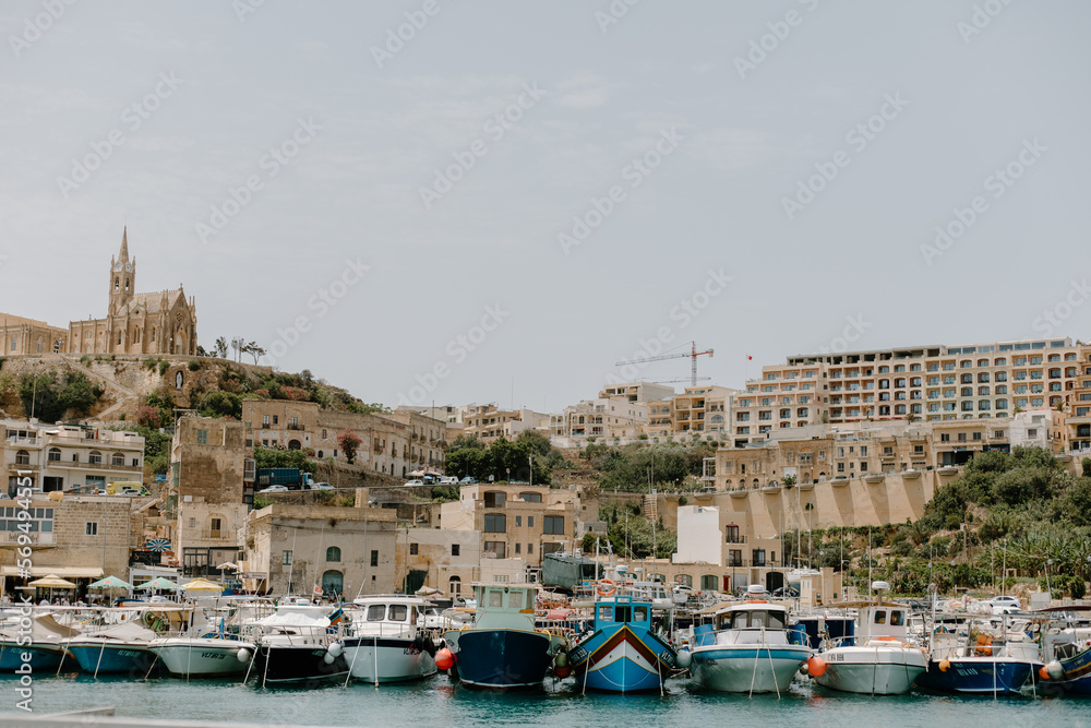 View of the ancient architecture and sail boats in Gozo Island, Malta