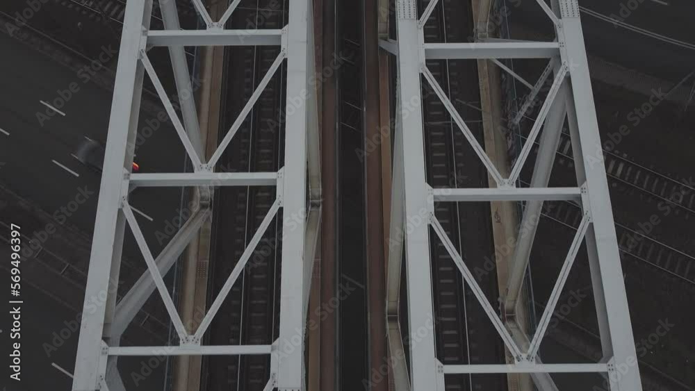 Close up Top down tracking drone video of train tracks on a bridge