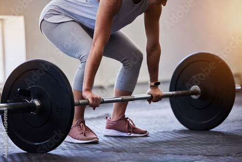 Woman bodybuilder, barbell deadlift and gym for wellness, fitness or exercise for strong body on floor. Weightlifting, muscle development or workout for health, challenge or performance for self care