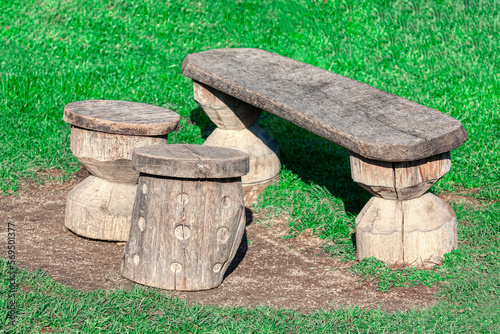 Wooden seats and table on the grass . Place for picnic 