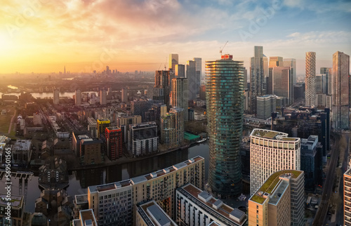 Panoramic sunset view of the residential and corporate skyscrapers at Canary Wharf London, England, with the skyline of the City in the background