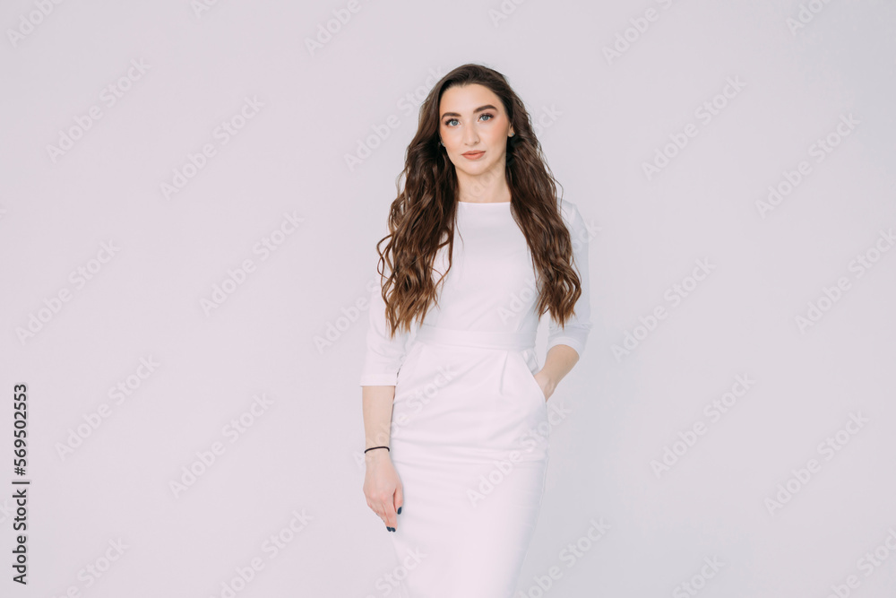 young girl doctor in a white dressing gown stands on a white background young girl doctor in a white dressing gown stands on a white background