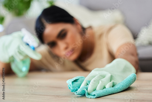 Tableau sur toile Hand, cleaning and cloth with a woman housekeeper wiping a wooden furniture surface using disinfectant