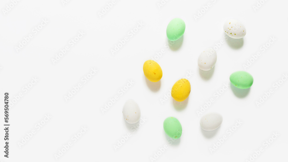 Lots of Candy easter eggs  on white background.	