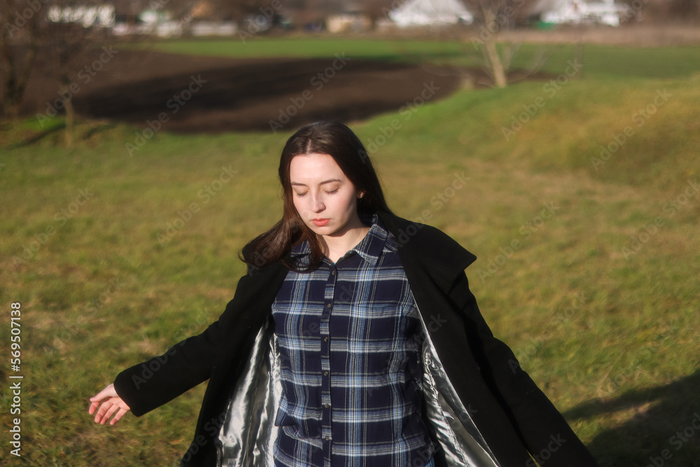 Lady in black.Girl feels a sense of freedom and calmness.Girl goes to meet the sun.Vintage retro portrait.Shining clean skin.Girl in a green field.Good posture in motion.Sad look.The wind's blowing. Lady in black.Girl feels a sense of freedom and calmness.Girl goes to meet the sun.Vintage retro portrait.Shining clean skin.Girl in a green field.Good posture in motion.Sad look.The wind's blowing.