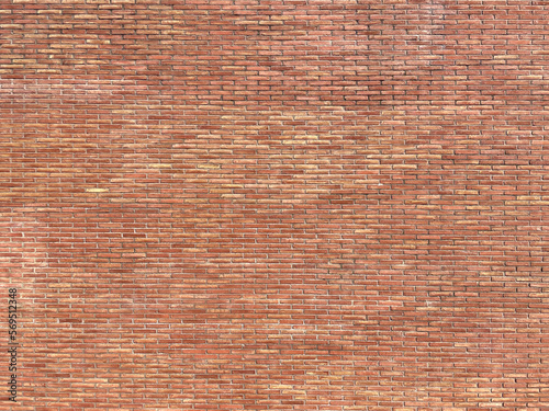 Wall with exposed solid ceramic brick aged by time. solid brick large scale texture.