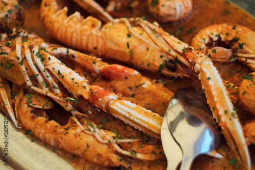 A seafood plate of delicious Adriatic catch of the day - scampi shrimps (škampi) in wine buzara sauce