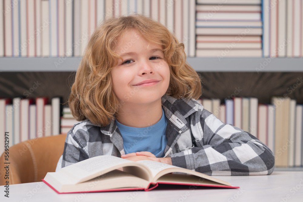 Back to school. Child in the library reads books. Schoolkid choosing book in school library. Kids literature for reading. Kid in bookstore. Learning from books. School education. Back to school. Child in the library reads books. Schoolkid choosing book in school library. Kids literature for reading. Kid in bookstore. Learning from books. School education.