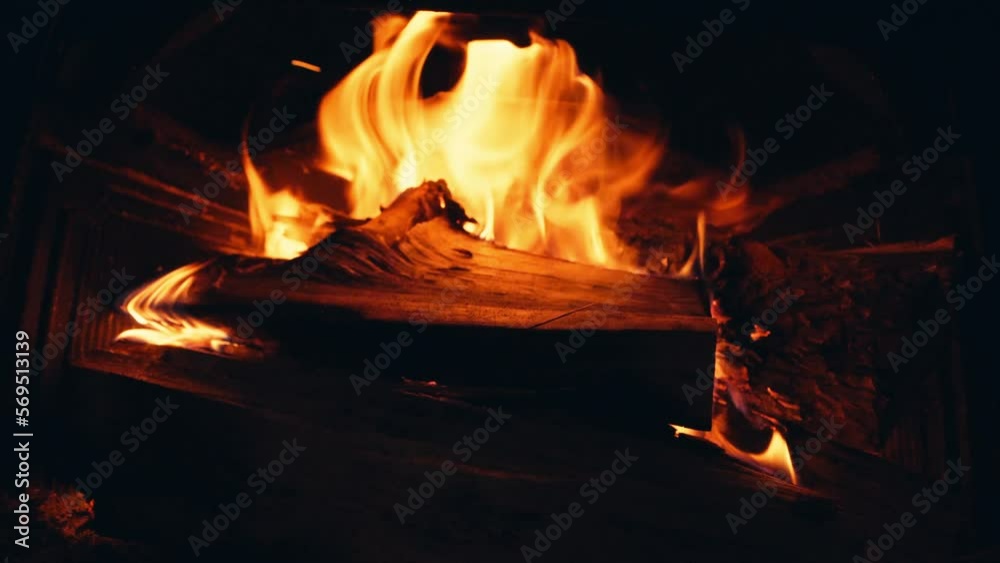 Wood Burning In The Fireplace With Red Hot Coals - close up Wood Burning In The Fireplace With Red Hot Coals - close up