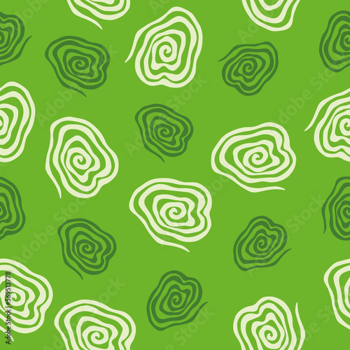 Spirals seamless vector pattern. Vector image on green background