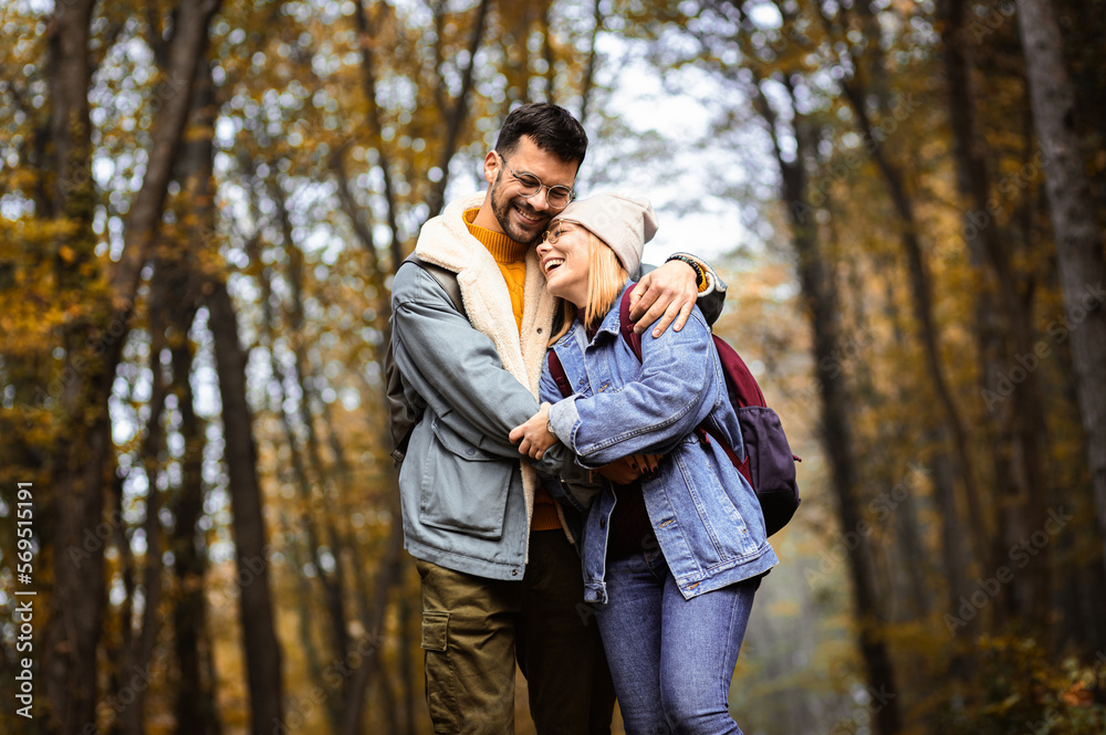 Fototapeta premium Couple spending time together walking in forest.