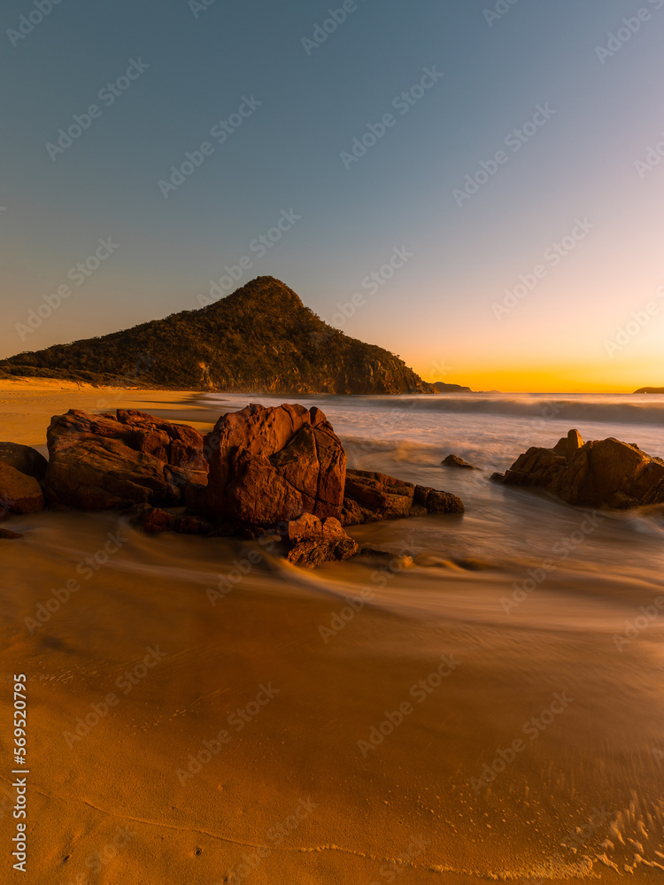 Sunrise view of Zenith Beach rocky coastline, Port Stephens, Australia.
