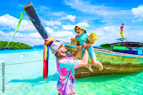father with her child on the beach in krabi thailand, tup island, chicken island 