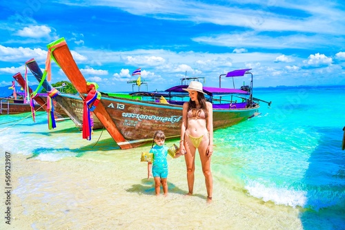 woman with her child on the beach in krabi thailand, chicken island, tup island, model shooting 