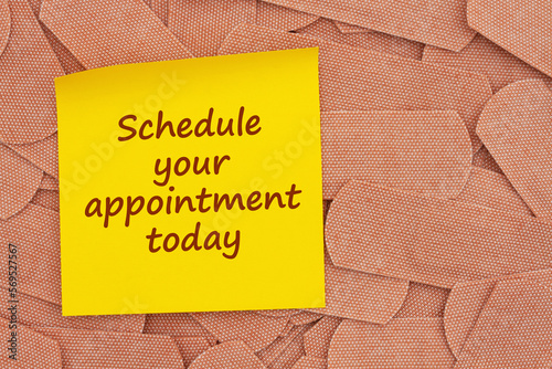 Schedule your appointment today on sticky note with lots of fabric adhesive band aids
