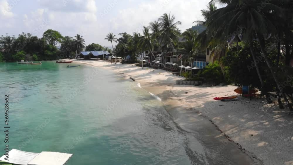 Drone view of boats on Perhentian Island coastline - moving forward Drone view of boats on Perhentian Island coastline - moving forward