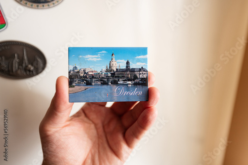 Dresden, Germany souvenir refrigerator magnet at hand. photo