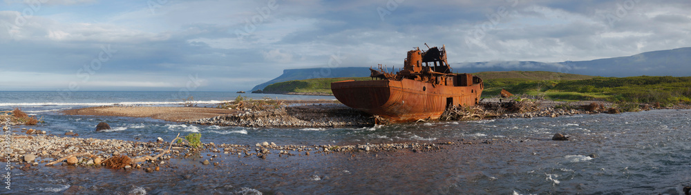 Paramushir, Russia, August 2022: Panoramic view of the sea port in Severo-Kurilsk, Paramushir island, Russia