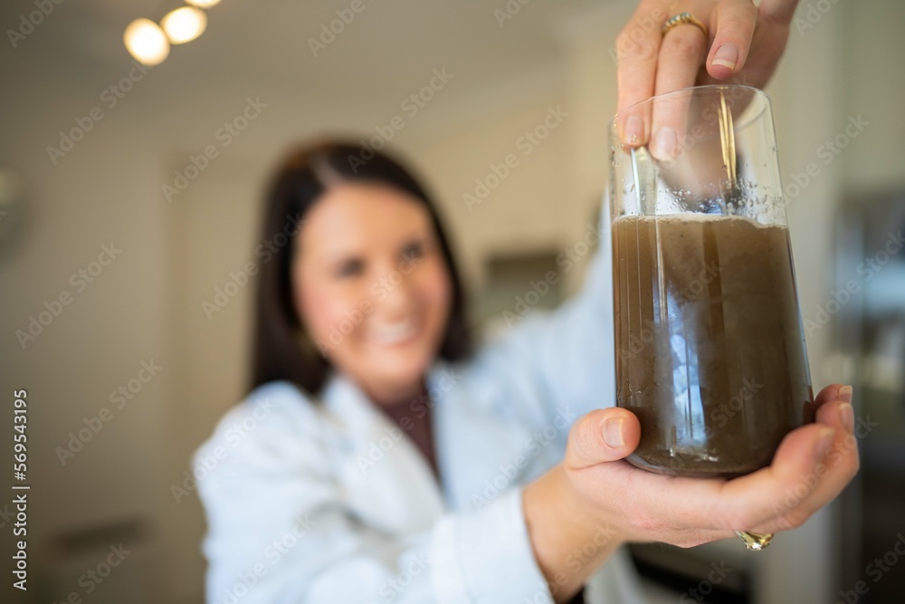 Soil test, female agricultural scientist conducting a soil test in a
