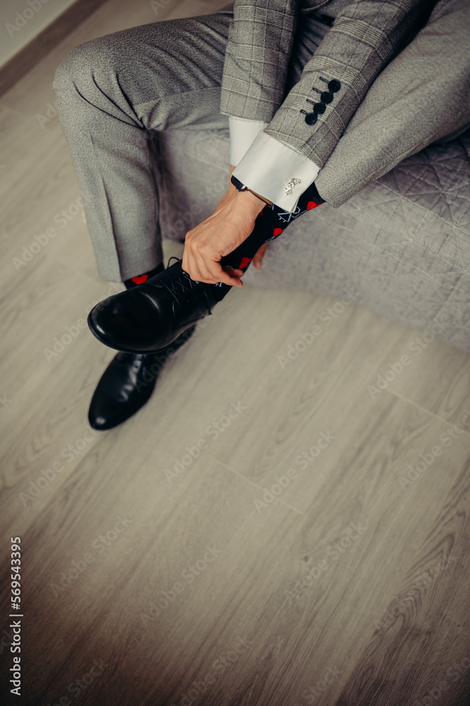Groom tie his shoes Groom tie his shoes