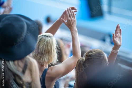 Photos fans watching a sporting match and sporting event in a stadium
