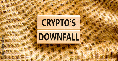 Crypto downfall symbol. Concept words Cryptos downfall on wooden blocks. Beautiful canvas table canvas background. Business and crypto downfall concept. Copy space. photo