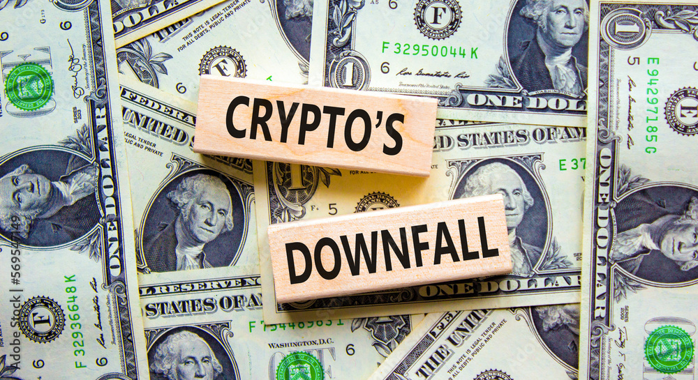 Crypto downfall symbol. Concept words Cryptos downfall on wooden blocks. Beautiful background from dollar bills. Business and crypto downfall concept. Copy space.