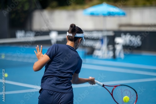female Professional athlete Tennis player playing on a court in a tennis tournament in summer in australia photo