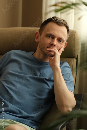 Man relaxing on sofa.