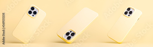 set of three silver iPhones 13 and 14 pro max in banana yellow silicone case falling down in different angles, back view isolated on yellow background, phone case mockup in monochrome colours