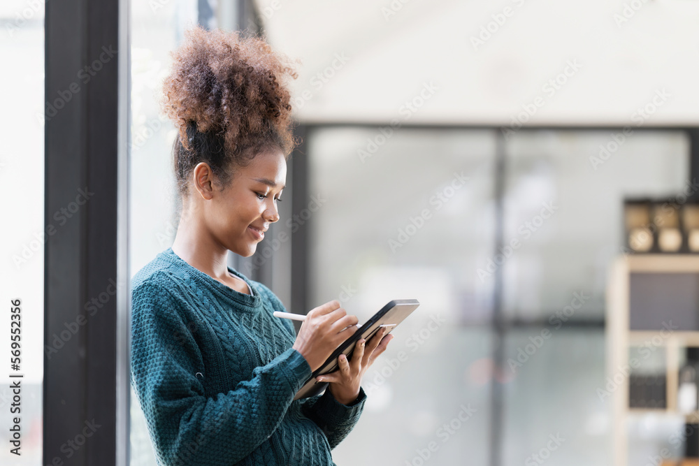 Beautiful young woman working using tablet at home Beautiful young woman working using tablet at home