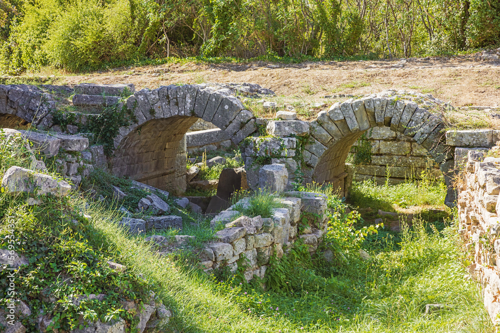 Close up of a ruined vaulted bridge in the Roman ruins of Salona, just outside Solin near Split