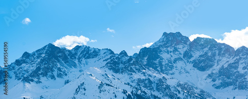 natural landscape with distant snowy mountain range blue in atmospheric haze © Evgeny