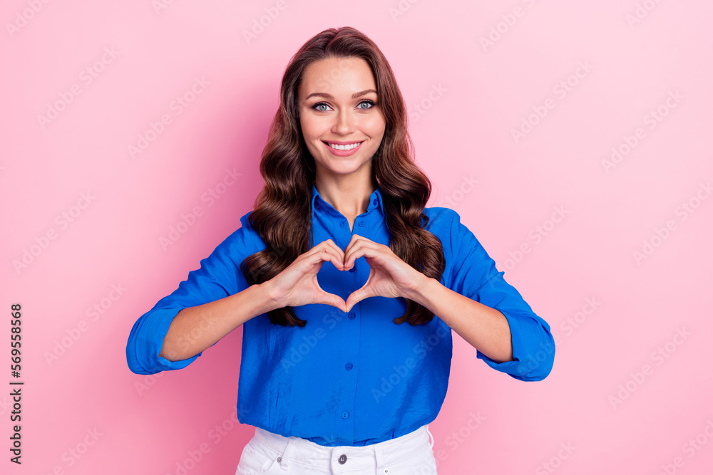 Photo of cute positive smiling cheerful lady wearing formal blue blouse show fingers love her new hr vacancy job isolated on pink color background Photo of cute positive smiling cheerful lady wearing formal blue blouse show fingers love her new hr vacancy job isolated on pink color background