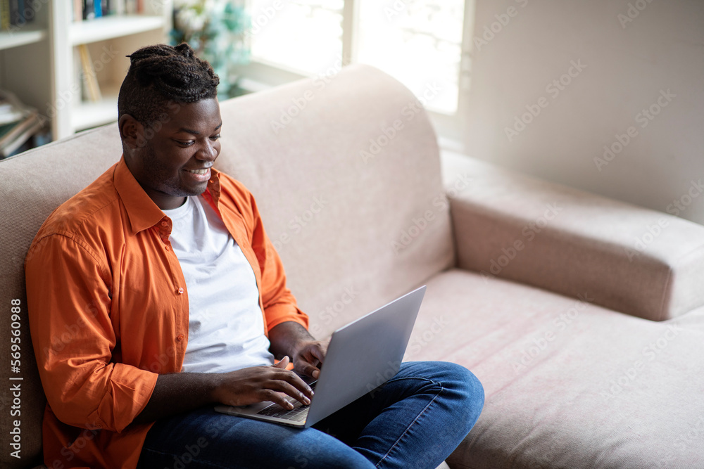 High angle view of black guy freelancer working from home