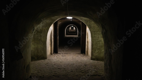 Underground protective structures in the form of military bomb shelter tunnels. Catacombs in the fortress. Fortification, background