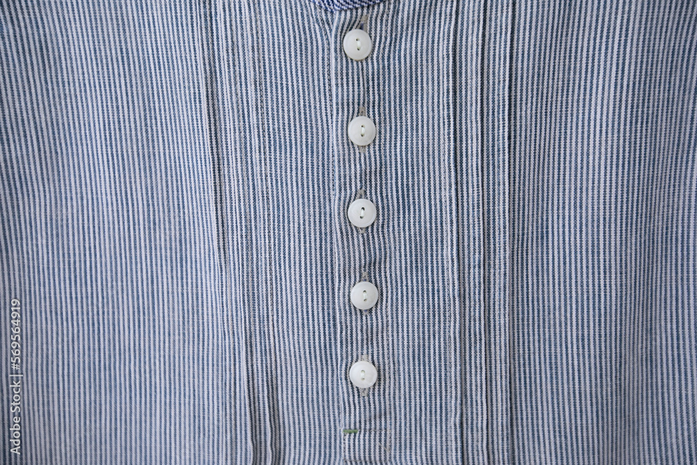 Full frame Button down shirt on handmade sewing lace in woman shirt.close up. Full frame Button down shirt on handmade sewing lace in woman shirt.close up.
