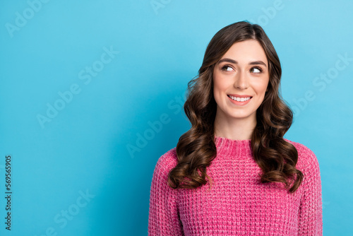 Photo of pretty cute lady dressed pink clothes interested look empty space offer banner ad isolated on blue color background