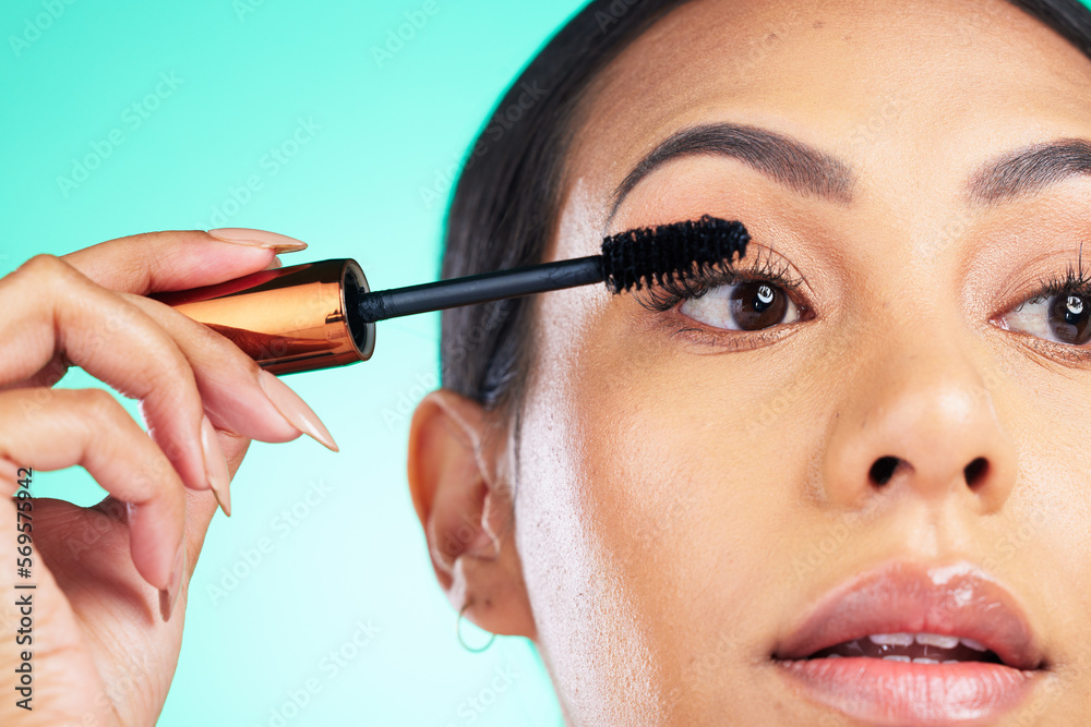 Woman, face closeup and beauty with mascara for lashes, makeup tools and cosmetic product with microblading Cosmetics, skin and brush in hand for eyelash extension, self care on studio background