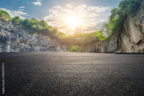 Asphalt road and mountain with sky clouds background at sunset