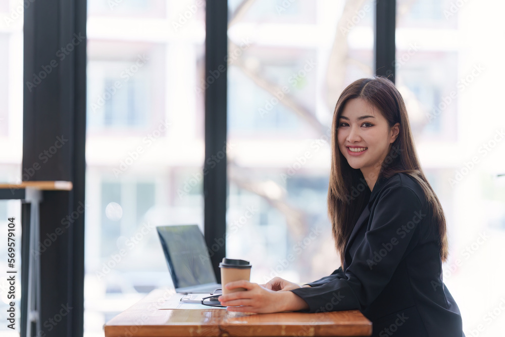 Asian Business woman working at home office and analyze financial report document. Accounting and Finance concept Asian Business woman working at home office and analyze financial report document. Accounting and Finance concept