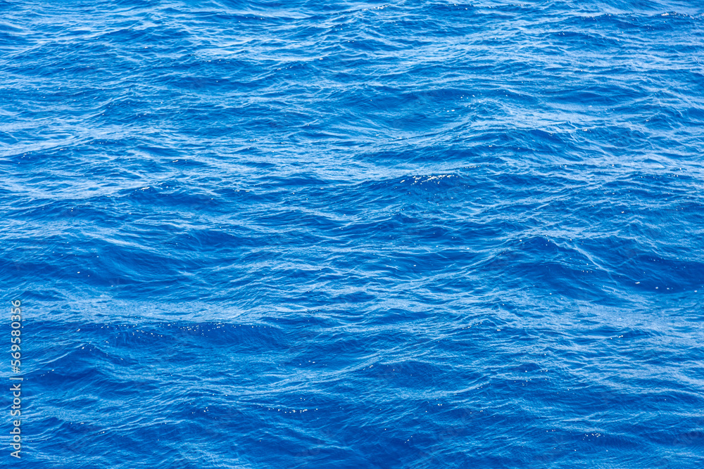 Very nice sea water background or backdrop with selective focus. Small waves of natural water surface texture. Very nice sea water background or backdrop with selective focus. Small waves of natural water surface texture.