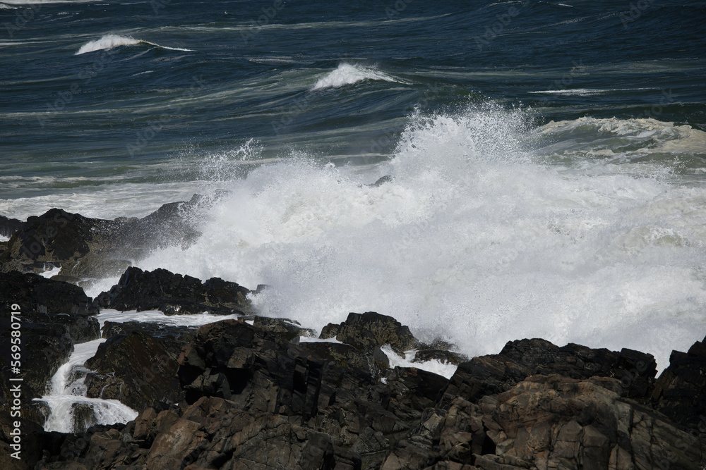 Ocean waves crashing on a rocky shore