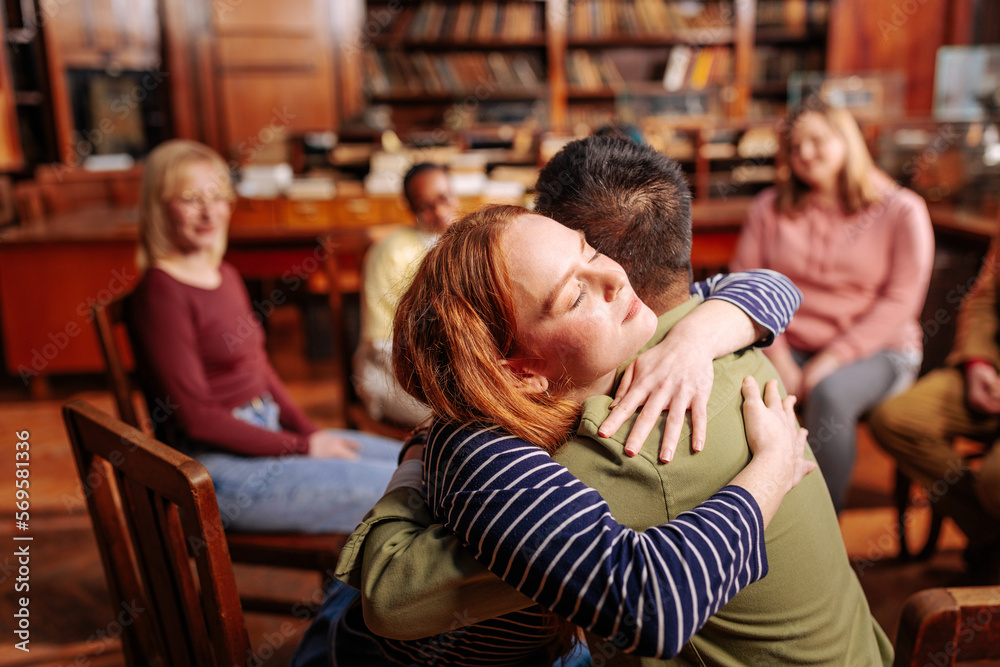 Patients hugging in counseling session. Patients hugging in counseling session.
