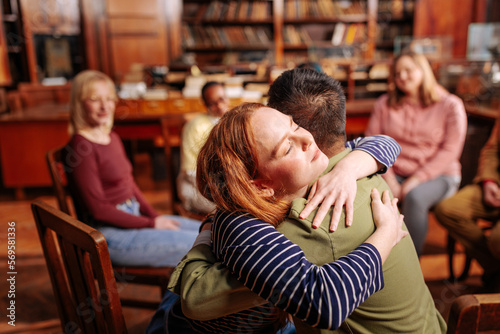 Patients hugging in counseling session. © bernardbodo