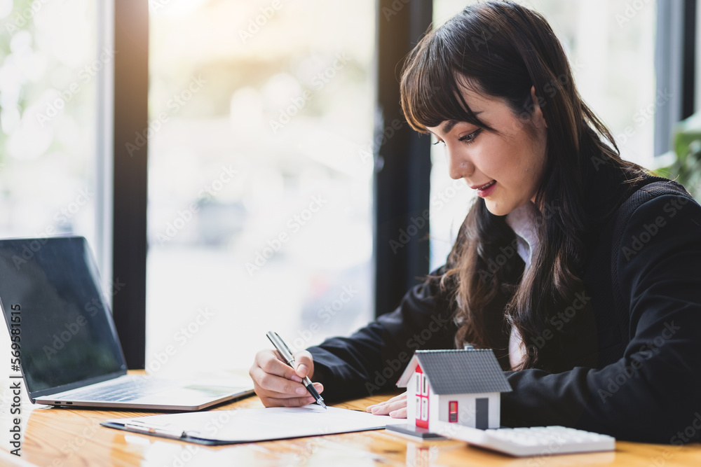 Businesswoman, real estate agent reading documents and legally signing contract agreement. Businesswoman, real estate agent reading documents and legally signing contract agreement.